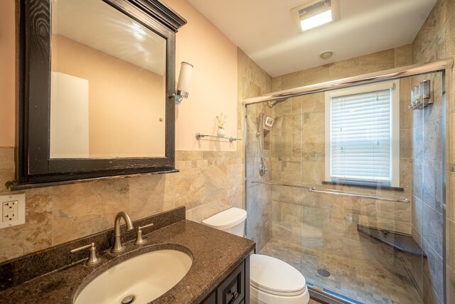 5 Forest Rd, Valley Stream, NY 11581 - bathroom featuring toilet, tile walls, a shower stall, and vanity