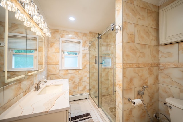 5 Forest Rd, Valley Stream, NY 11581 - bathroom featuring baseboard heating, a shower stall, vanity, toilet, and tile walls