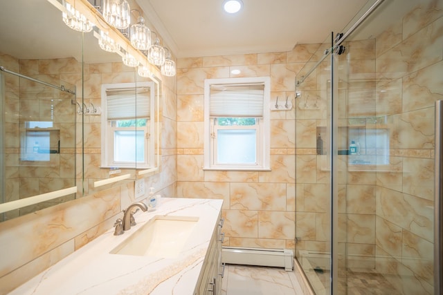 5 Forest Rd, Valley Stream, NY 11581 - bathroom with baseboard heating, a stall shower, vanity, tile walls, and a chandelier