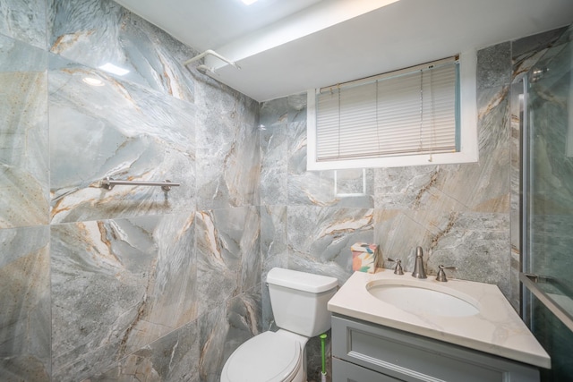 5 Forest Rd, Valley Stream, NY 11581 - bathroom with toilet, a shower, tile walls, and vanity