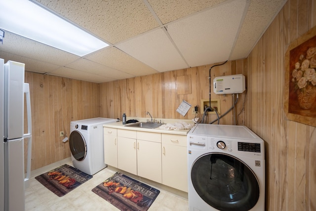 5 Forest Rd, Valley Stream, NY 11581 - laundry area with washer / clothes dryer, wood walls, and light flooring
