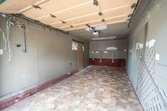 5 Forest Rd, Valley Stream, NY 11581 - garage featuring a garage door opener