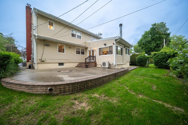 5 Forest Rd, Valley Stream, NY 11581 - rear view of house featuring a cooling unit, a chimney, a yard, and a patio