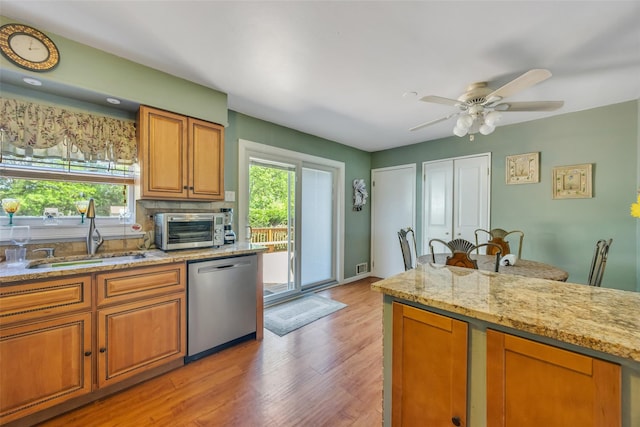 1623 Washington Ave, Bohemia, NY 11716 - kitchen featuring dishwasher, a sink, light wood finished floors, ceiling fan, and brown cabinets