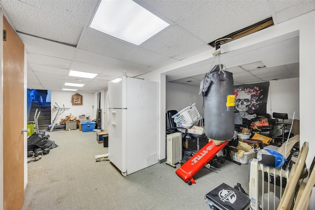 1623 Washington Ave, Bohemia, NY 11716 - finished below grade area with a drop ceiling and white fridge with ice dispenser
