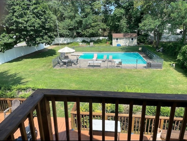 1623 Washington Ave, Bohemia, NY 11716 - view of swimming pool featuring a fenced backyard, a wooden deck, and an outbuilding