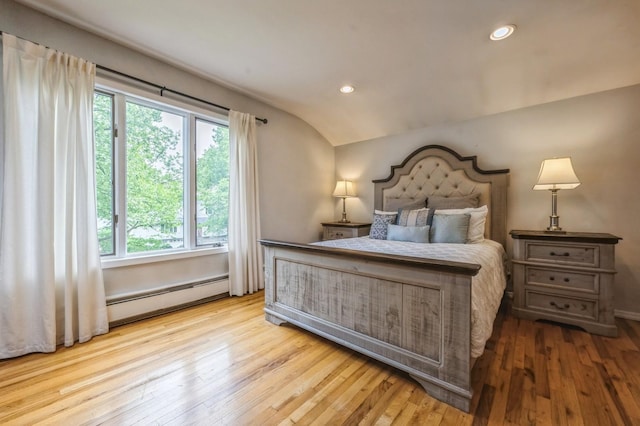 2 Caryl Pl, Kings Park, NY 11754 - bedroom with multiple windows, wood-type flooring, lofted ceiling, recessed lighting, and baseboard heating