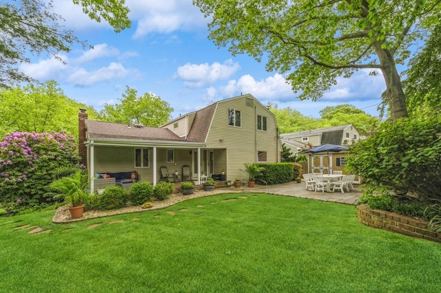 2 Caryl Pl, Kings Park, NY 11754 - rear view of property featuring a gambrel roof, a patio, a gazebo, a yard, and a chimney