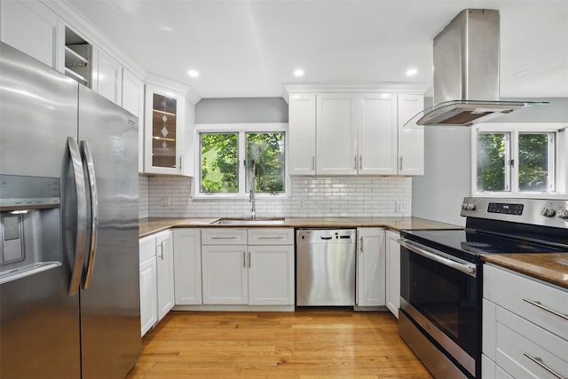 1 Renee Gate St, Cortlandt Manor, NY 10567 - kitchen with stainless steel appliances, a sink, island exhaust hood, light wood finished floors, and white cabinets