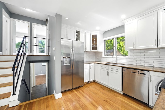 1 Renee Gate St, Cortlandt Manor, NY 10567 - kitchen featuring stainless steel appliances, a sink, light wood-style flooring, white cabinets, and recessed lighting