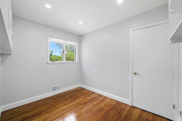 1 Renee Gate St, Cortlandt Manor, NY 10567 - unfurnished bedroom with wood finished floors, recessed lighting, and baseboards