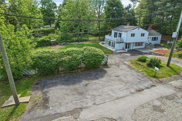 1 Renee Gate St, Cortlandt Manor, NY 10567 - view of front of home with asphalt driveway, a chimney, and a balcony