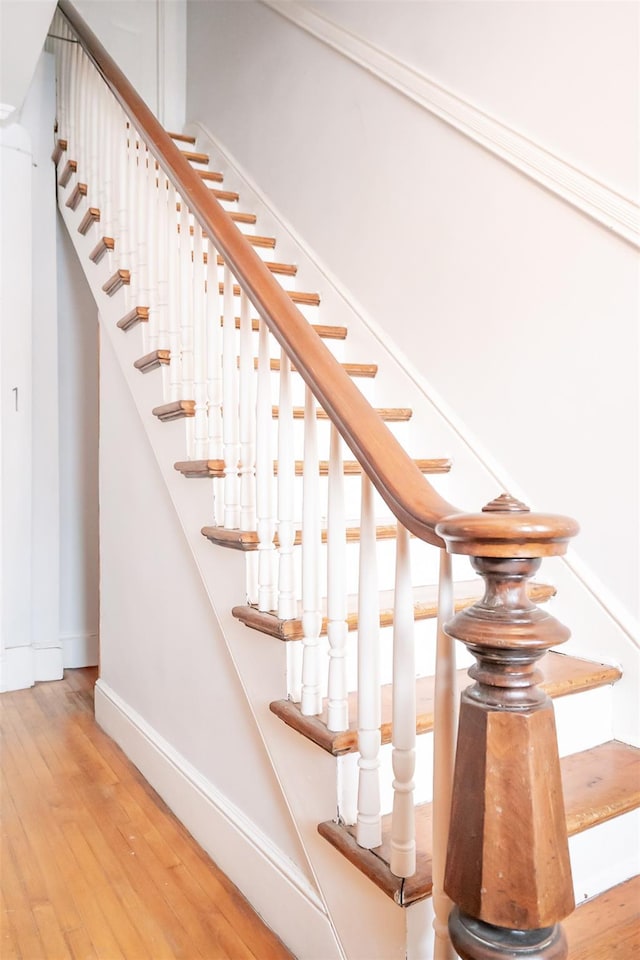 175 Liberty St, Newburgh, NY 12550 - staircase featuring baseboards and wood finished floors