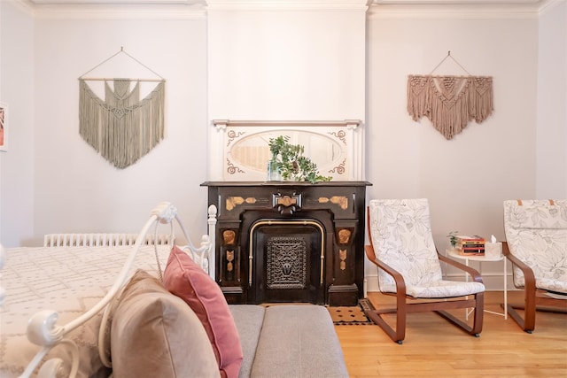 175 Liberty St, Newburgh, NY 12550 - bedroom with wood finished floors, ornamental molding, and a fireplace