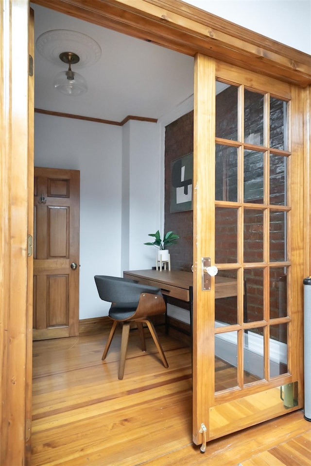175 Liberty St, Newburgh, NY 12550 - dining space featuring crown molding, wood finished floors, and baseboards