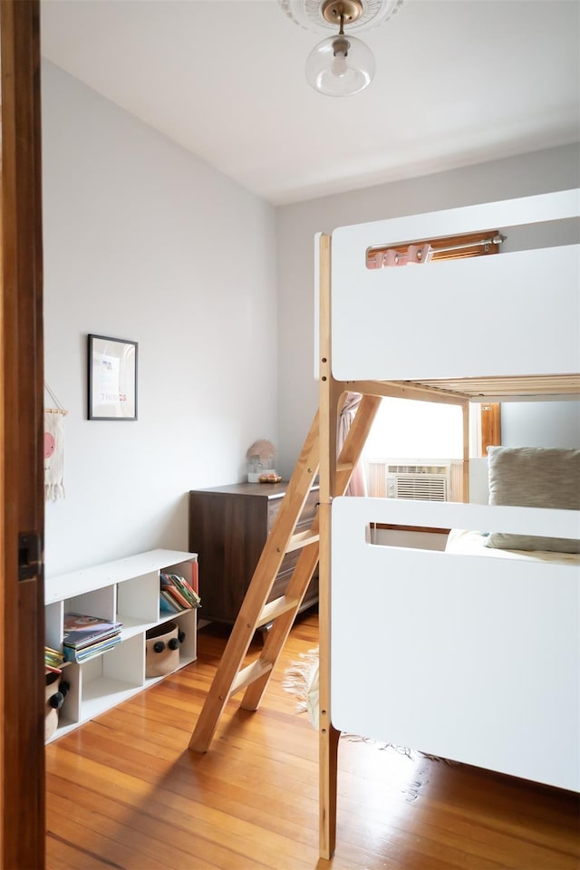 175 Liberty St, Newburgh, NY 12550 - bedroom featuring wood-type flooring and cooling unit