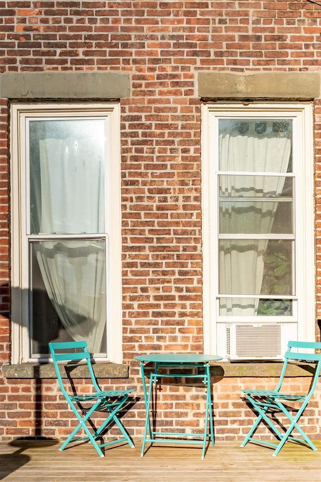 175 Liberty St, Newburgh, NY 12550 - property entrance with brick siding and cooling unit