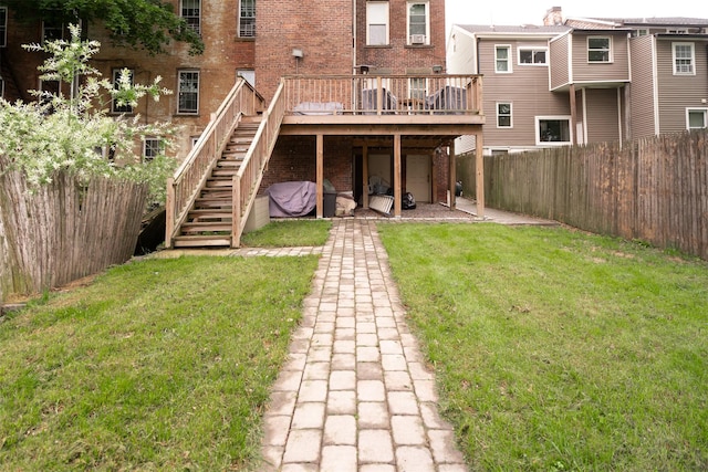 175 Liberty St, Newburgh, NY 12550 - rear view of property featuring brick siding, a deck, and stairway