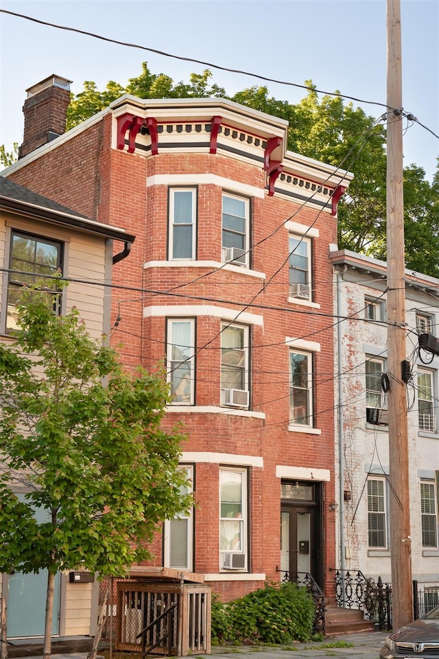 175 Liberty St, Newburgh, NY 12550 - view of front of house featuring cooling unit and brick siding