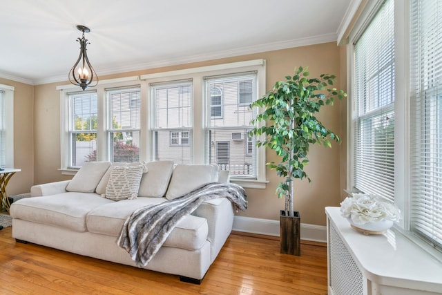 74 Buckingham Rd, West Hempstead, NY 11552 - living area featuring healthy amount of natural light, light wood-type flooring, baseboards, and crown molding