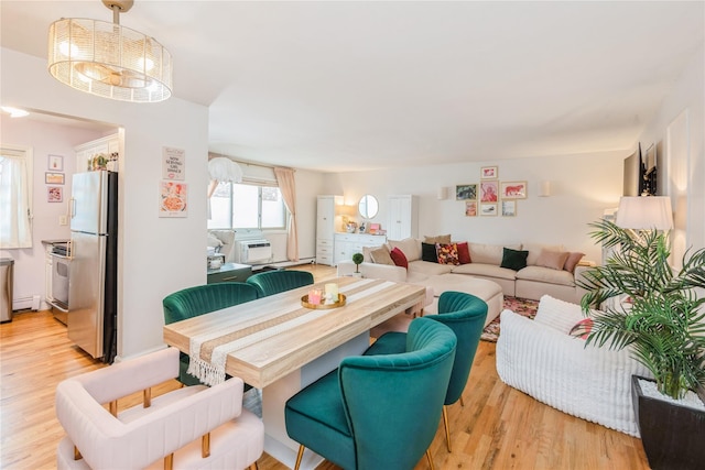 2453 Union Blvd Unit 11A, Islip, NY 11751 - living area featuring light wood-type flooring and a baseboard radiator
