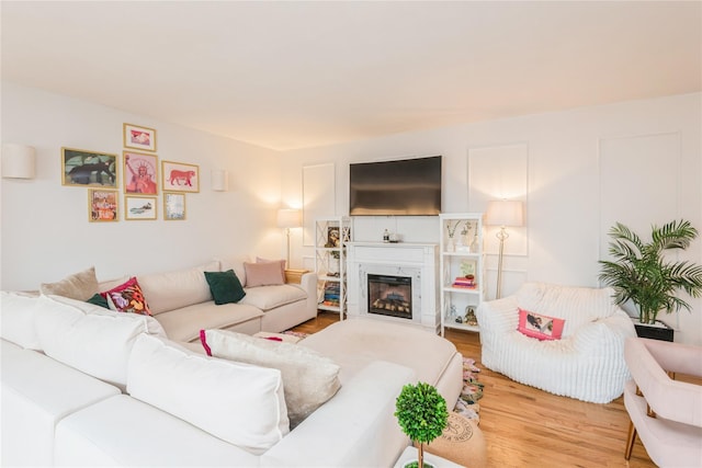 2453 Union Blvd Unit 11A, Islip, NY 11751 - living room with wood finished floors and a glass covered fireplace