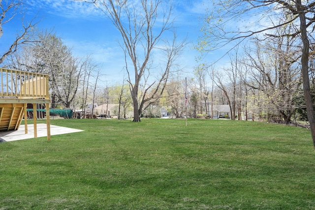 2939 N Wading River Rd, Wading River, NY 11792 - view of green lawn featuring a deck, stairway, and a patio area