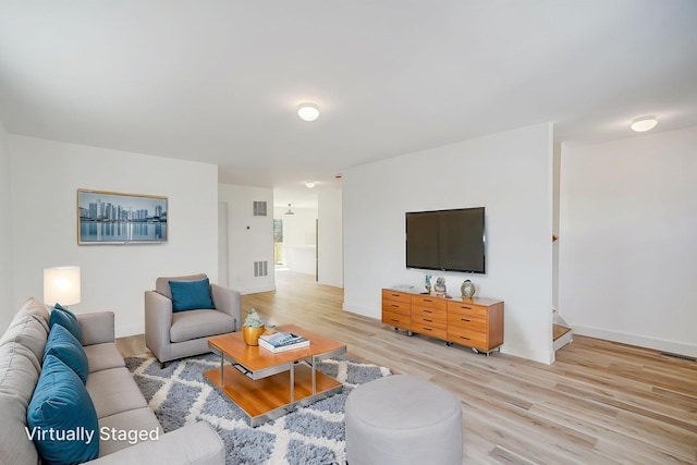 2939 N Wading River Rd, Wading River, NY 11792 - living room featuring light wood-style flooring and baseboards
