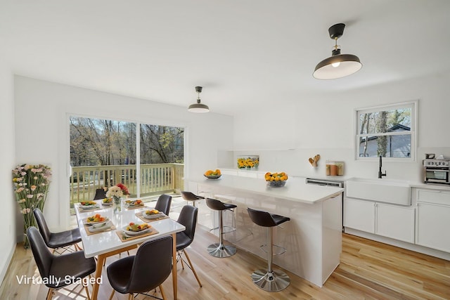2939 N Wading River Rd, Wading River, NY 11792 - dining space featuring healthy amount of natural light and light wood-style flooring