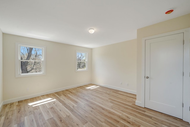2939 N Wading River Rd, Wading River, NY 11792 - unfurnished bedroom featuring light wood-style floors and baseboards