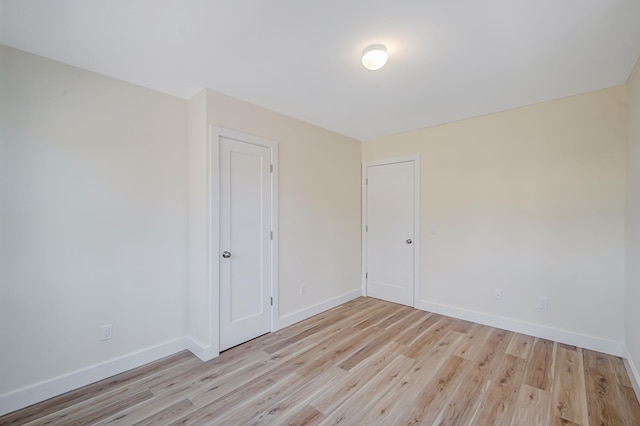 2939 N Wading River Rd, Wading River, NY 11792 - unfurnished room featuring baseboards and wood finished floors