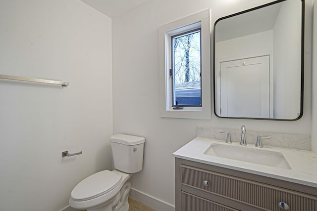 2939 N Wading River Rd, Wading River, NY 11792 - bathroom with baseboards, vanity, and toilet