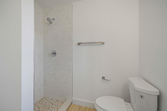 2939 N Wading River Rd, Wading River, NY 11792 - full bath featuring toilet, tiled shower, and wood finished floors
