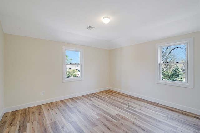 2939 N Wading River Rd, Wading River, NY 11792 - empty room featuring plenty of natural light, light wood-type flooring, and baseboards