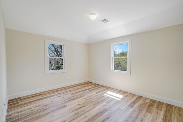 2939 N Wading River Rd, Wading River, NY 11792 - empty room featuring plenty of natural light, light wood finished floors, and baseboards