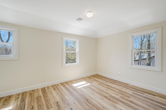2939 N Wading River Rd, Wading River, NY 11792 - spare room featuring baseboards and light wood-style floors