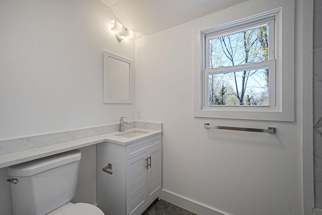 2939 N Wading River Rd, Wading River, NY 11792 - bathroom featuring toilet, vanity, and baseboards