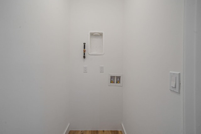 2939 N Wading River Rd, Wading River, NY 11792 - washroom with washer hookup, wood finished floors, and baseboards