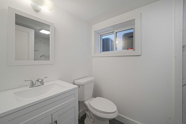 2939 N Wading River Rd, Wading River, NY 11792 - bathroom featuring vanity, toilet, and baseboards
