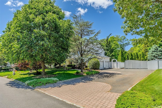 4 Pak Ct, East Setauket, NY 11733 - obstructed view of property featuring a gate, driveway, and a garage