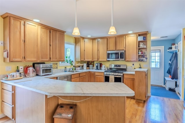 4 Pak Ct, East Setauket, NY 11733 - kitchen featuring appliances with stainless steel finishes, light countertops, open shelves, healthy amount of natural light, and recessed lighting