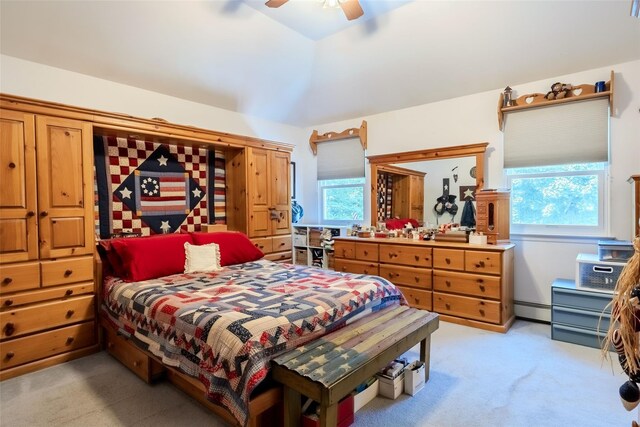4 Pak Ct, East Setauket, NY 11733 - bedroom with light colored carpet, baseboard heating, ceiling fan, and vaulted ceiling