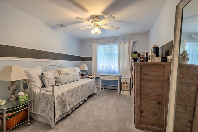 4 Pak Ct, East Setauket, NY 11733 - bedroom with carpet, baseboard heating, and a ceiling fan