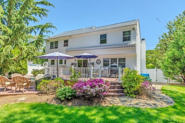 4 Pak Ct, East Setauket, NY 11733 - back of house featuring a deck and a gate