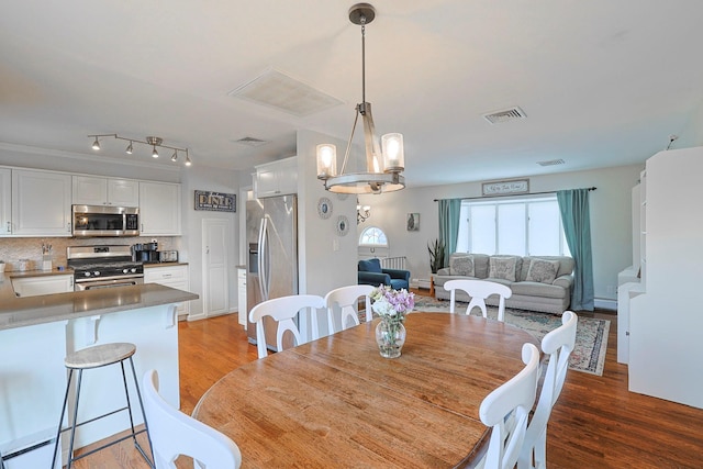 8 Country Ln, Warwick, NY 10990 - dining room with light wood-type flooring, a chandelier, and a baseboard radiator