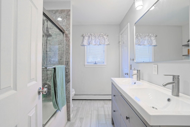 8 Country Ln, Warwick, NY 10990 - full bathroom featuring a baseboard radiator, an enclosed shower, double vanity, and toilet