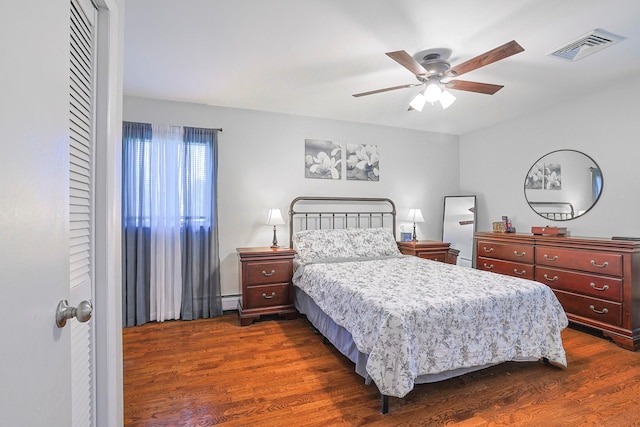 8 Country Ln, Warwick, NY 10990 - bedroom featuring dark wood-style floors, a baseboard radiator, and ceiling fan