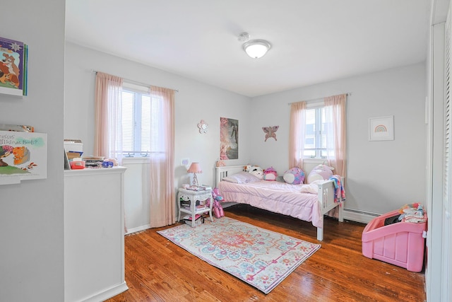 8 Country Ln, Warwick, NY 10990 - bedroom featuring wood finished floors and a baseboard radiator