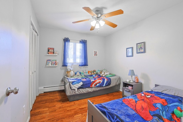 8 Country Ln, Warwick, NY 10990 - bedroom featuring a baseboard radiator, wood finished floors, a closet, and ceiling fan