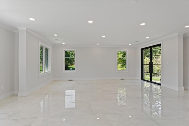 2 Henry St, Great Neck, NY 11023 - empty room with plenty of natural light, ornamental molding, light marble finish floors, recessed lighting, and baseboards